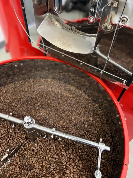 Freshly roasted coffee in Ruby Roasters cooling tray