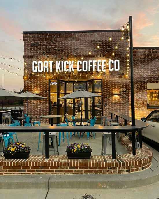 The patio and front entrance of Goat Kick Coffee's Evans Towne Center location
